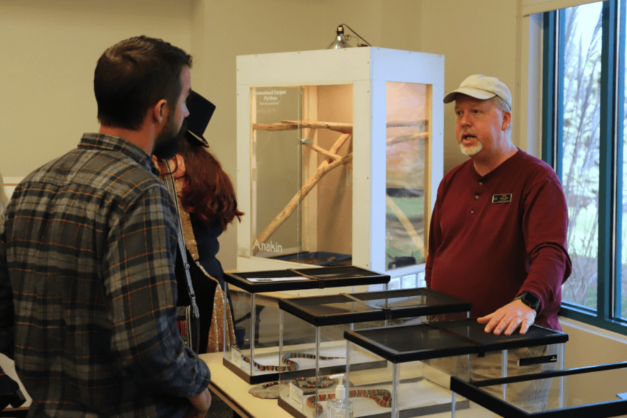 Dan Taylor discussing reptiles with visitors