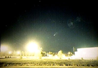 Comet Hale-Bopp, as seen from the proposed site of a new observatory on the CSI campus. The Herrett Center for Arts and Science can be seen at lower right.